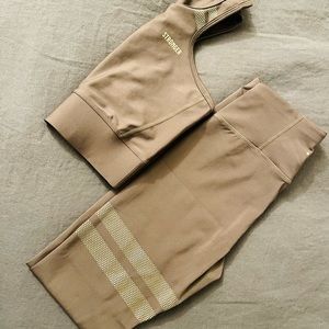 Stronger workout set. Size S bra top and pants with detailing around thigh.